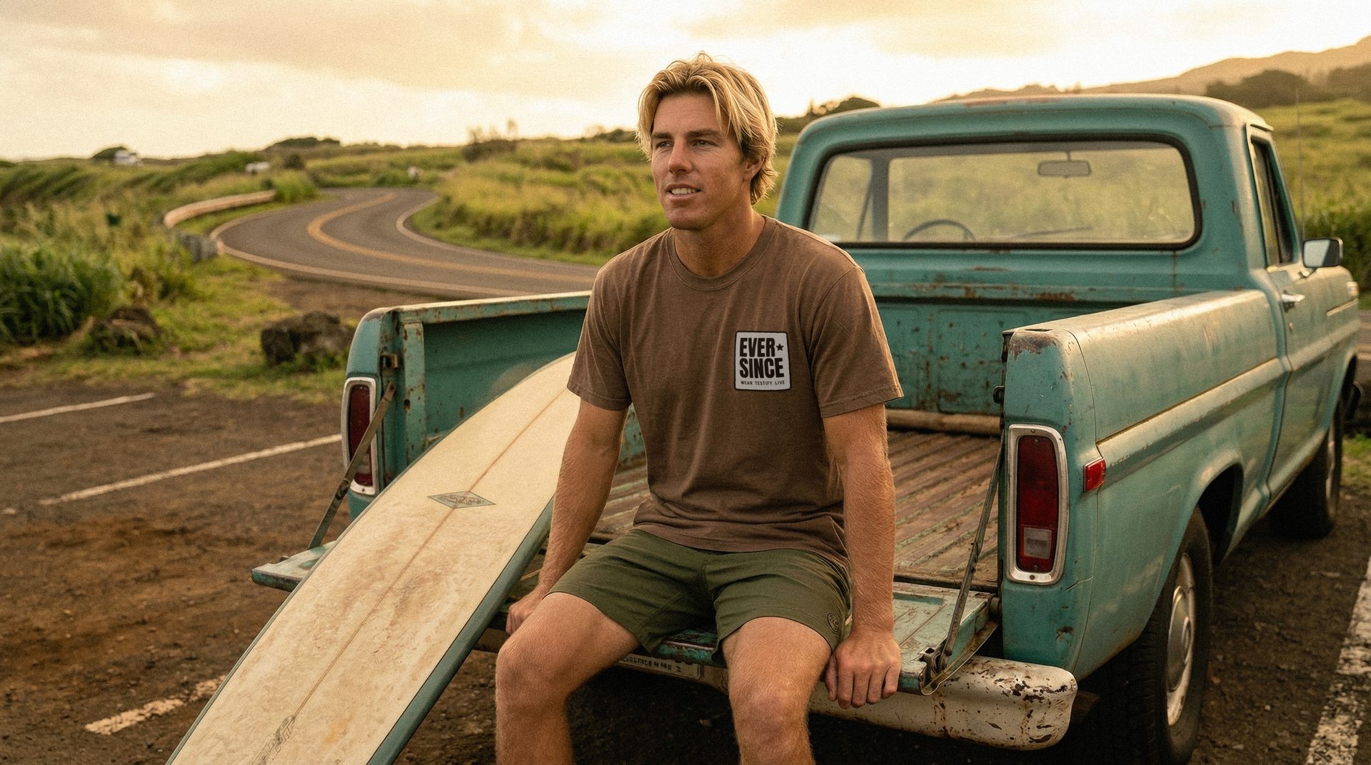 Finn with his truck in the wilderness wearing a personalized salvation year t-shirt